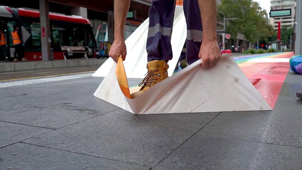 Walk&Wall(R) being removed from a transit station floor.