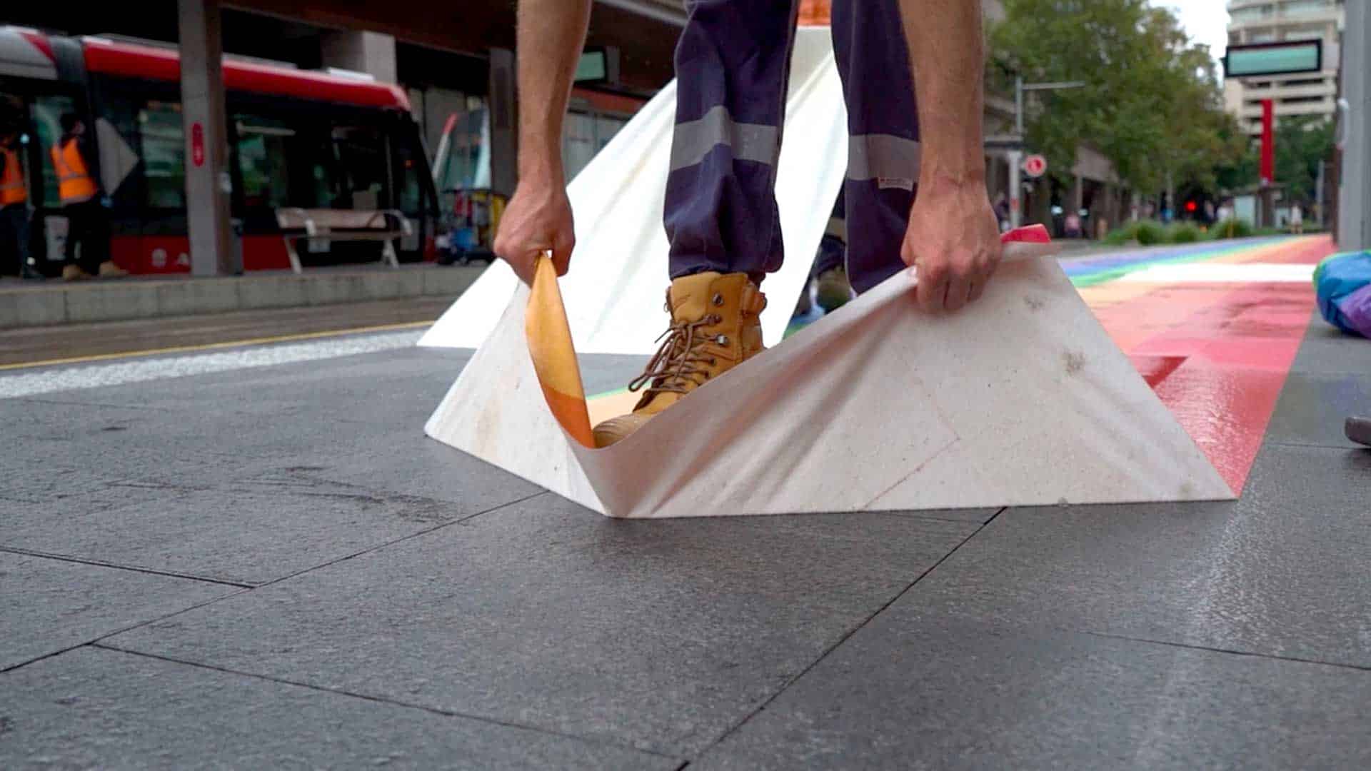 Walk&Wall(R) being removed from a transit station floor.