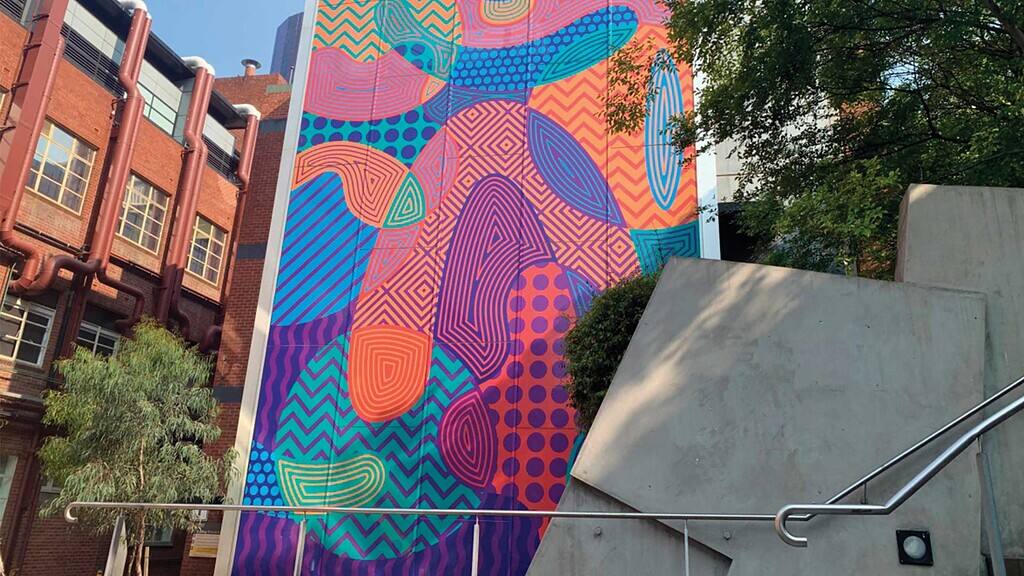 Perforated window film used on an exterior building wrap.